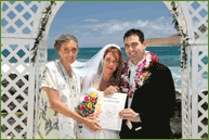 Couple by the oceanfront with their certificate